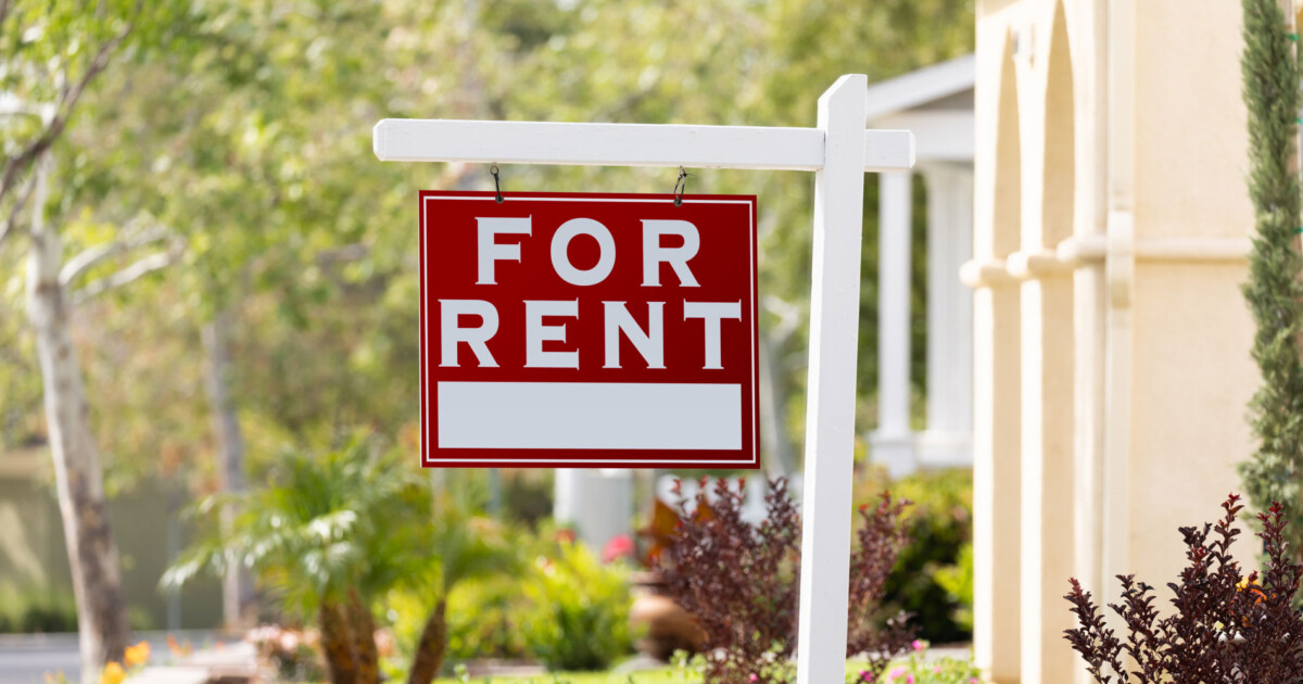 Single-family home with a 'For Rent' sign, ready for accidental landlord rental conversion