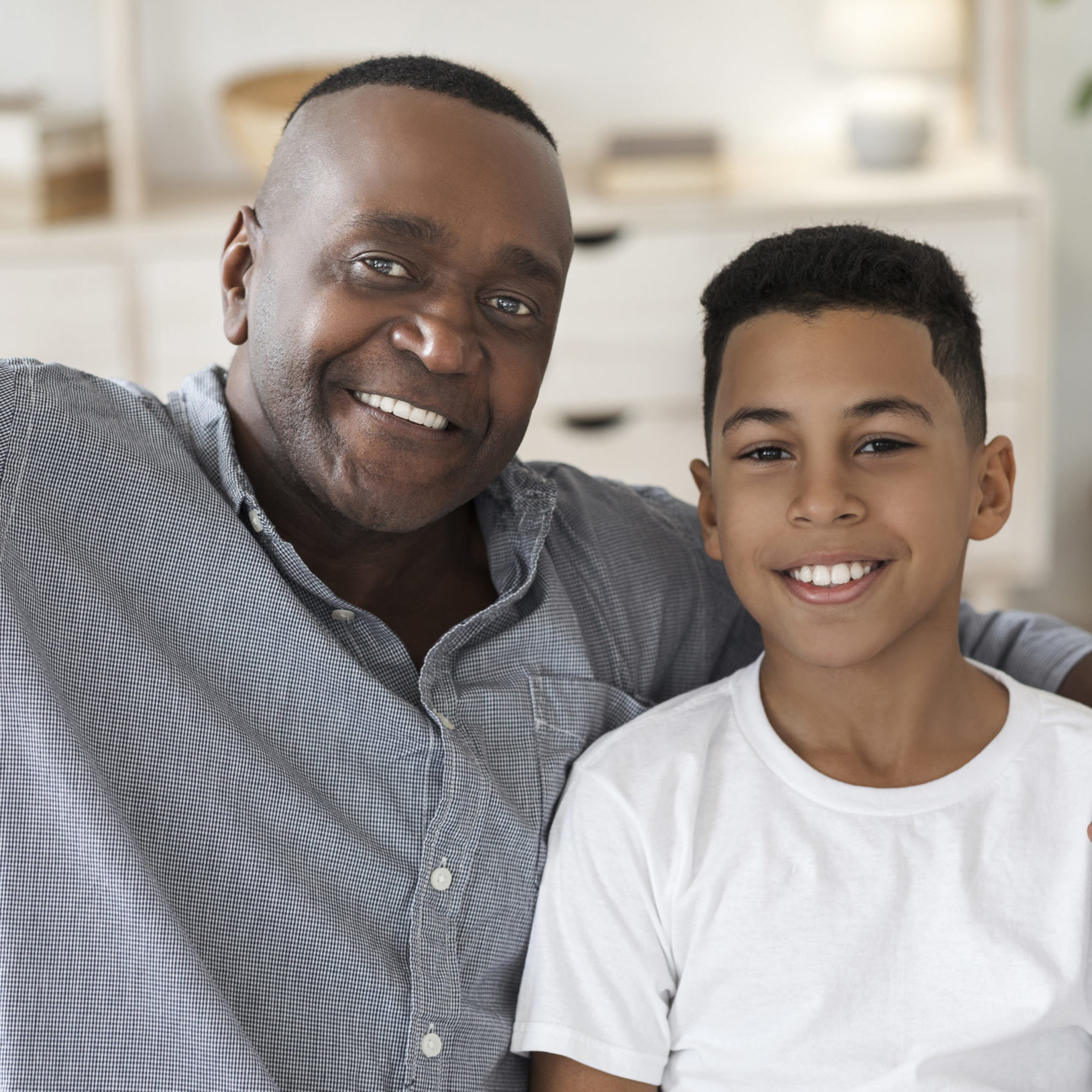 Selfie With Grandfather. Happy african american granddad and his preteen grandson posing for photo together at home, closeup